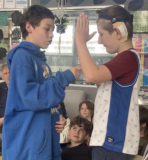 Two students working together in drama.